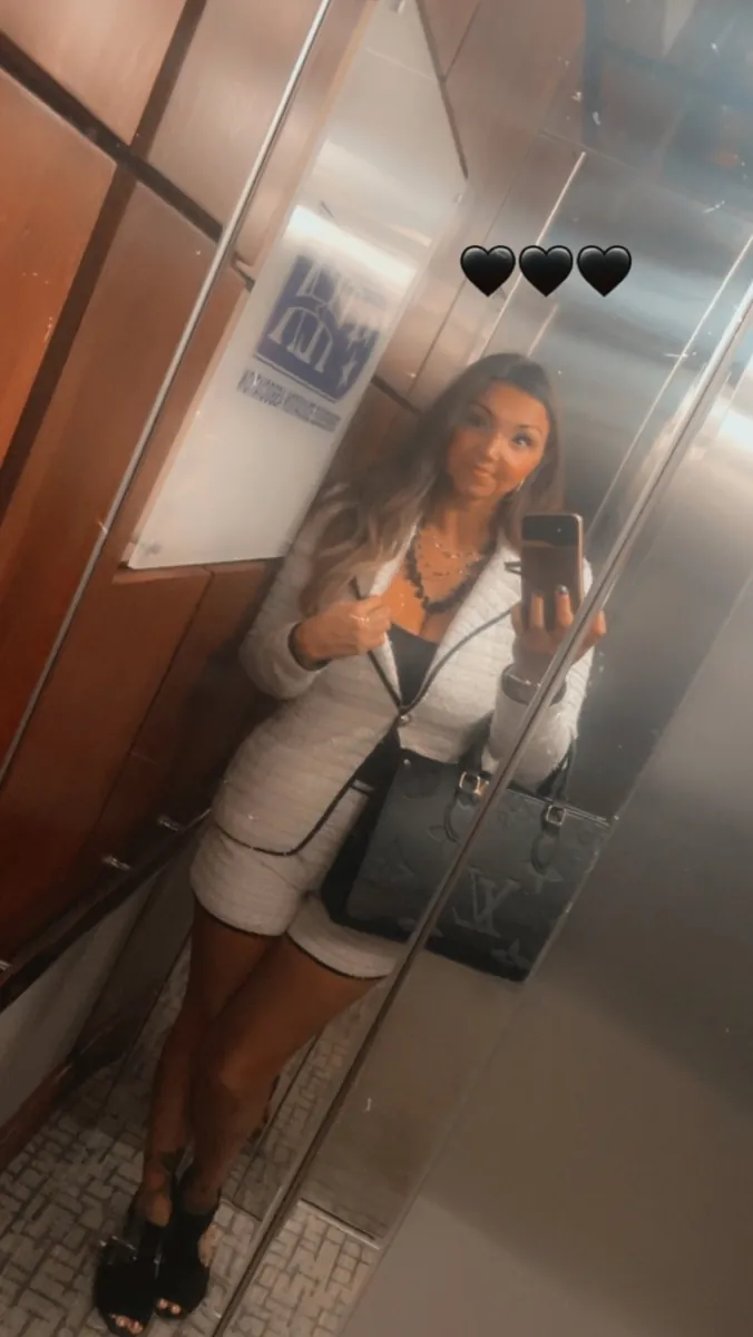Danielle Lemons in a white tweed suit. Danielle Lemons, Vice President of Operations at DirecTech Connect, in a white tweed suit.