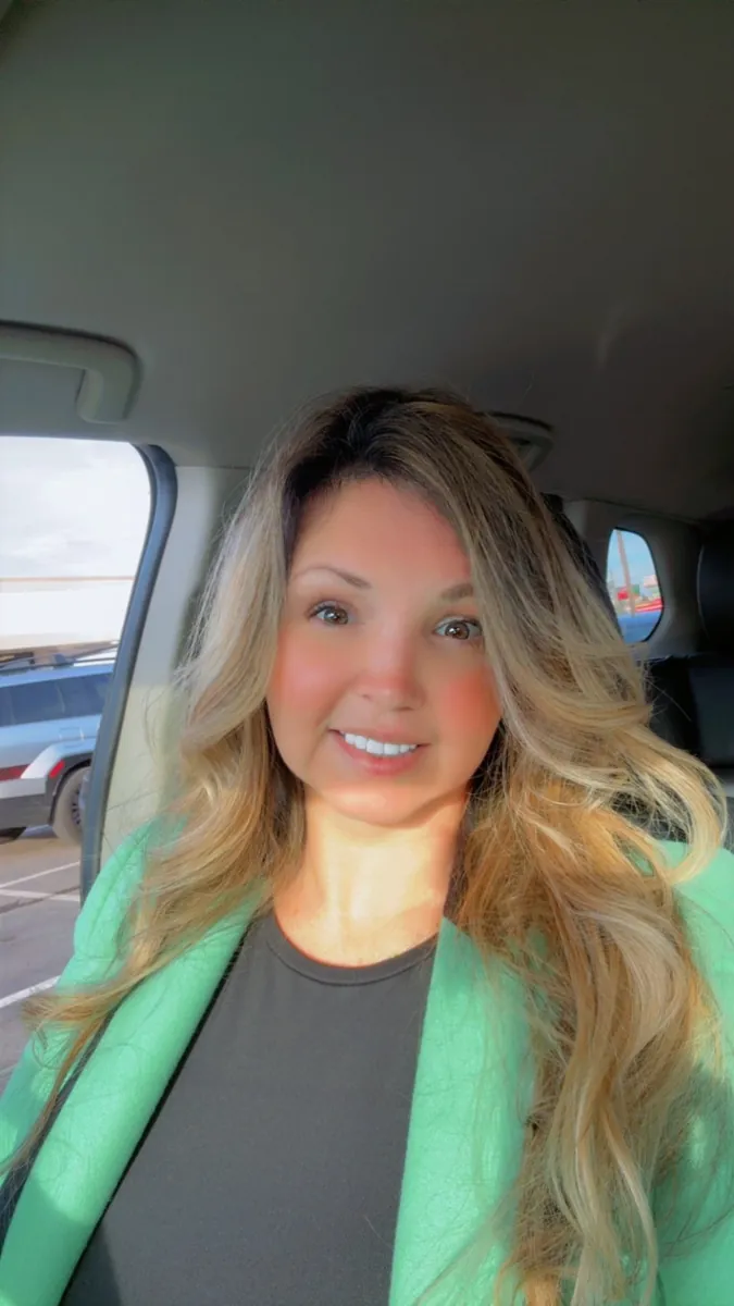 Danielle Lemons in a green blazer. Danielle Lemons, Vice President of Operations at DirecTech Connect, smiling in a mint green blazer.