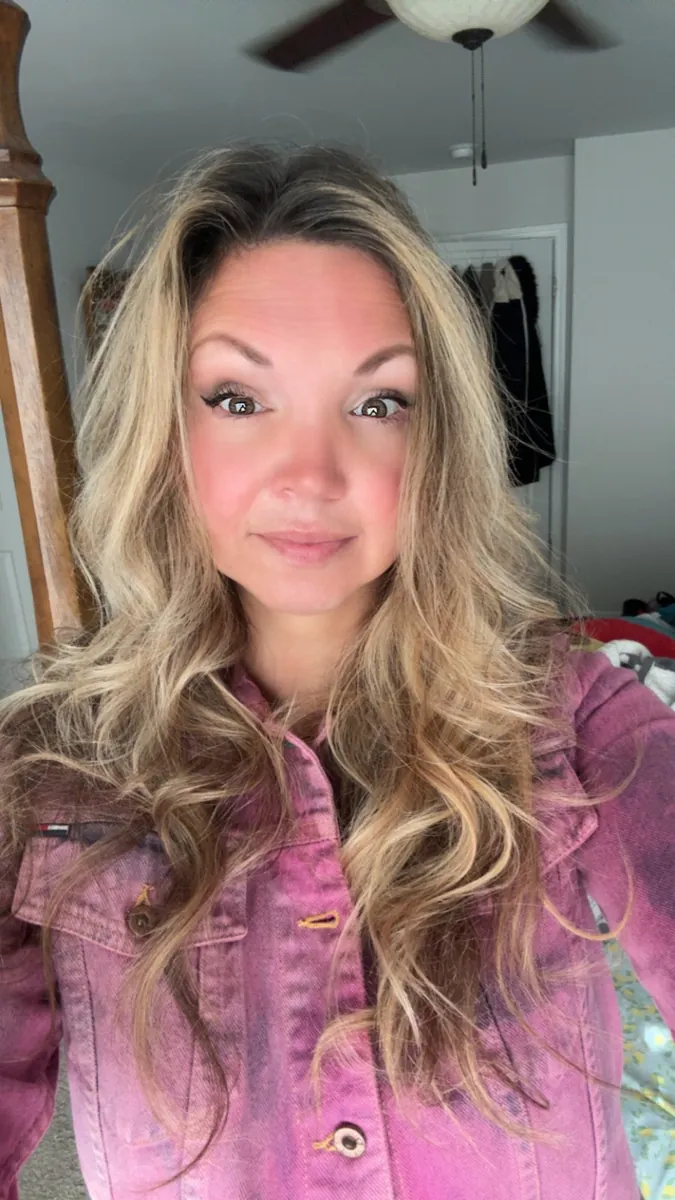 Danielle Lemons in a pink denim jacket. Danielle Lemons, Vice President of Operations at DirecTech Connect, in a pink denim jacket.