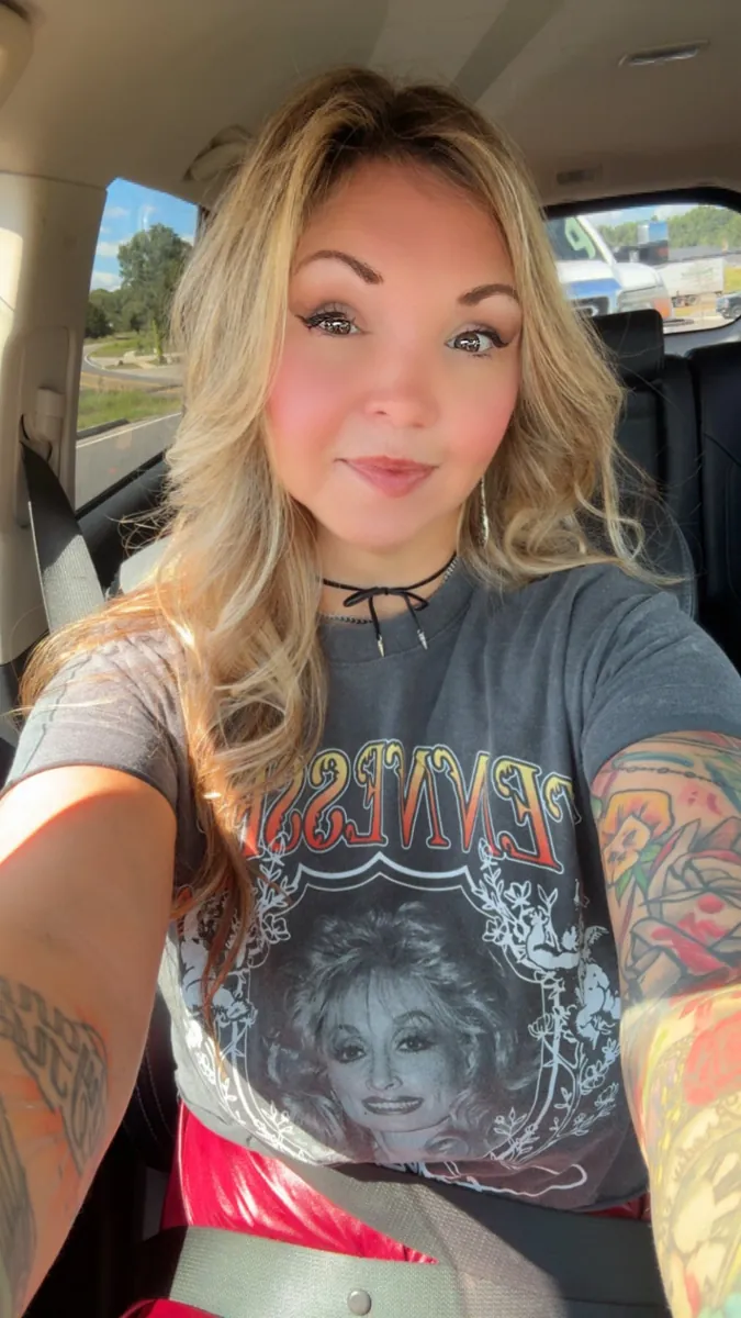 Danielle Lemons showing Tennessee pride. Danielle Lemons, Vice President of Operations at DirecTech Connect, showing some Tennessee pride in a gray Tennessee t-shirt.