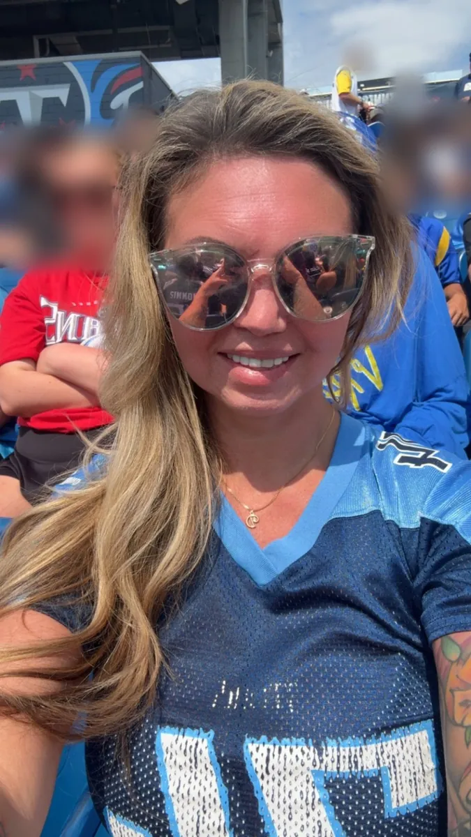 Danielle Lemons at a Tennessee Titans home game. Danielle Lemons, Vice President of Operations at DirecTech Connect, cheering on the Tennessee Titans at a home game in Nashville.