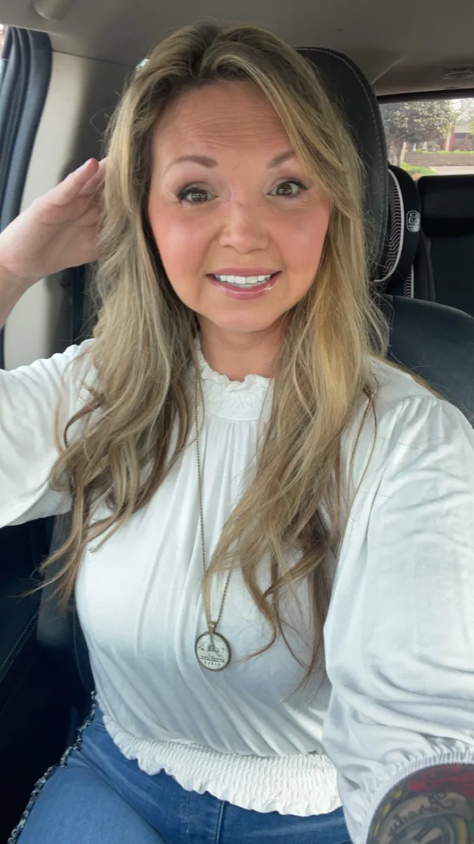 Danielle Lemons smiling in a white blouse. Danielle Lemons, Vice President of Operations at DirecTech Connect, smiling in a white blouse.